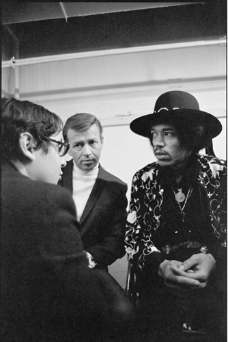 Jimi Hendrix with promoter Pat O’Day (center) backstage at the Seattle Center Arena, February 12, 1968. Photographer: Ulvis Alberts. MoPOP permanent collection.